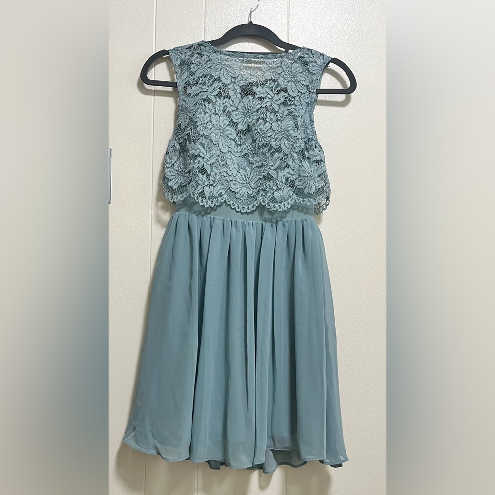 - Short fit, flare dress Blue, sleeveless, high neck, inserted bra